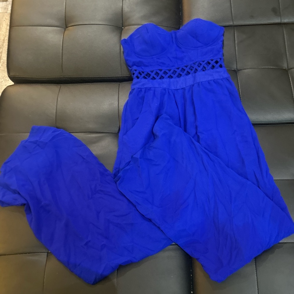 Blue strapless jumpsuit with a corset top and flared pants
